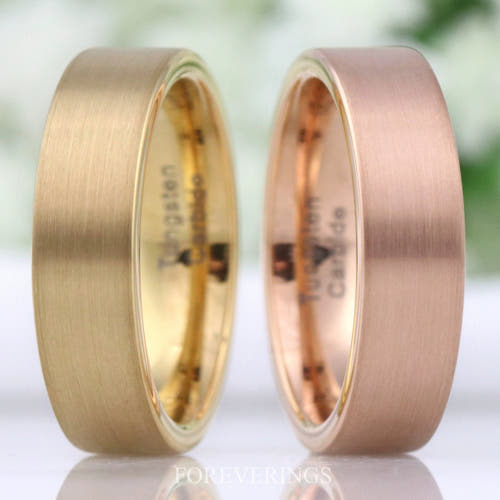 Men's 6mm matte gold and rose gold tungsten bands standing side by side