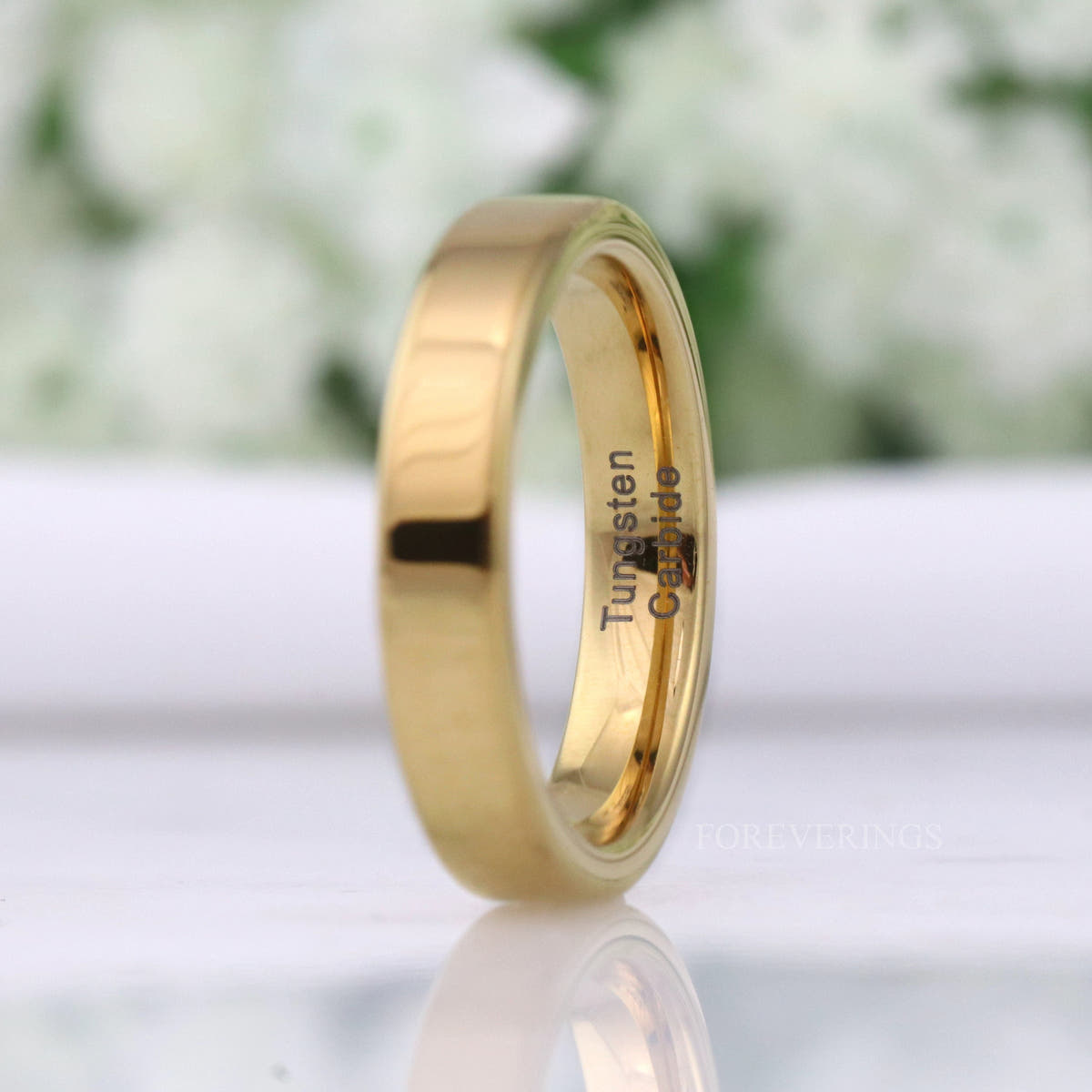 4mm flat gold tungsten band angled to show the polished interior