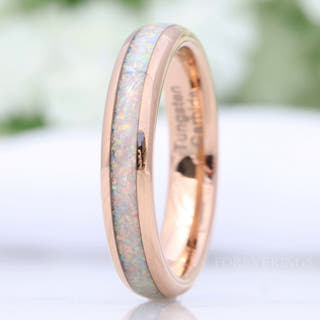 Women's 4mm rose gold tungsten ring with crushed white fire opal inlay, close-up angled view