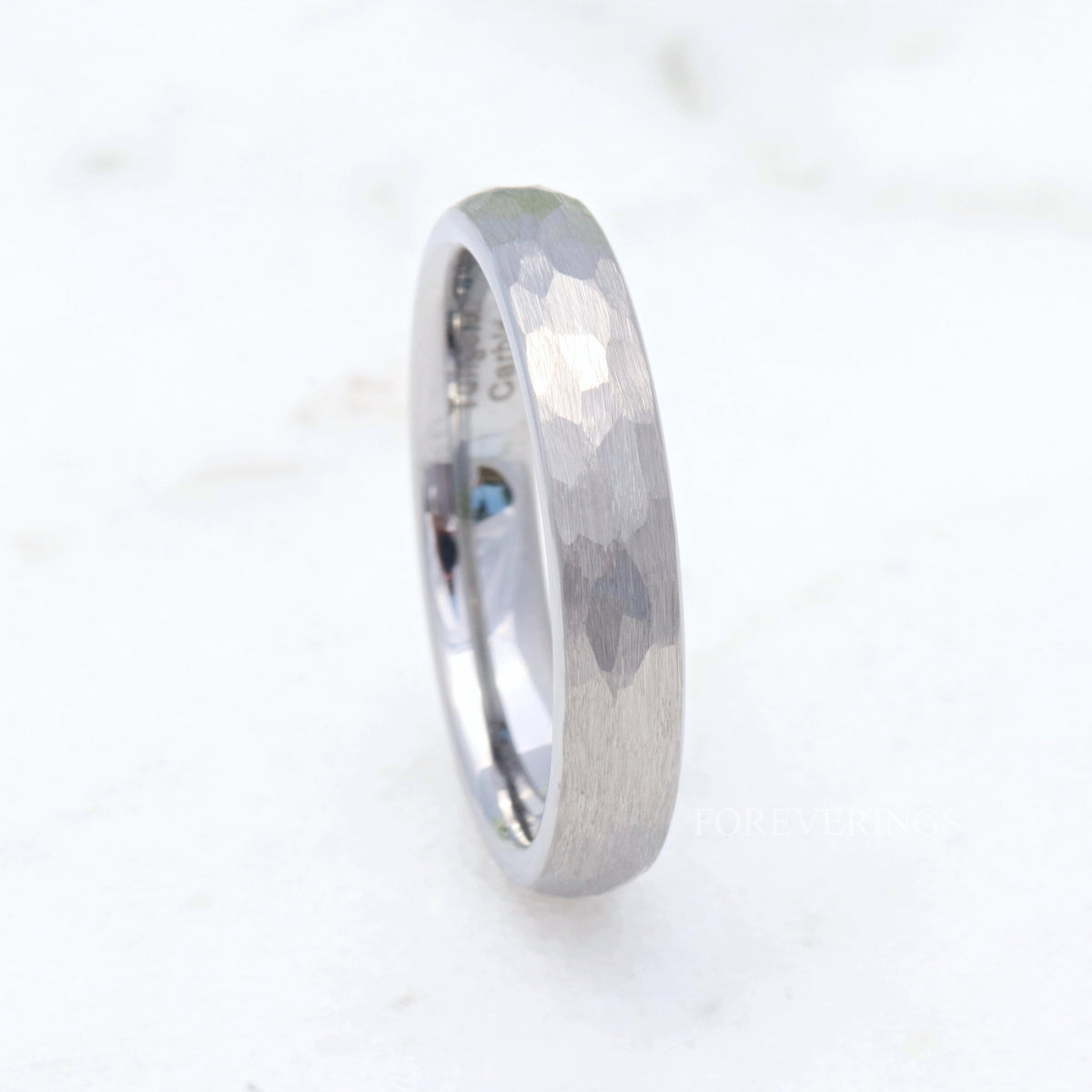 4mm matte hammered silver tungsten band on a plain white background