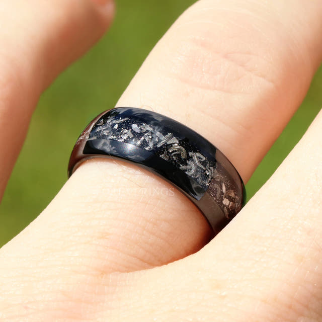 8mm black tungsten meteorite band worn on a finger