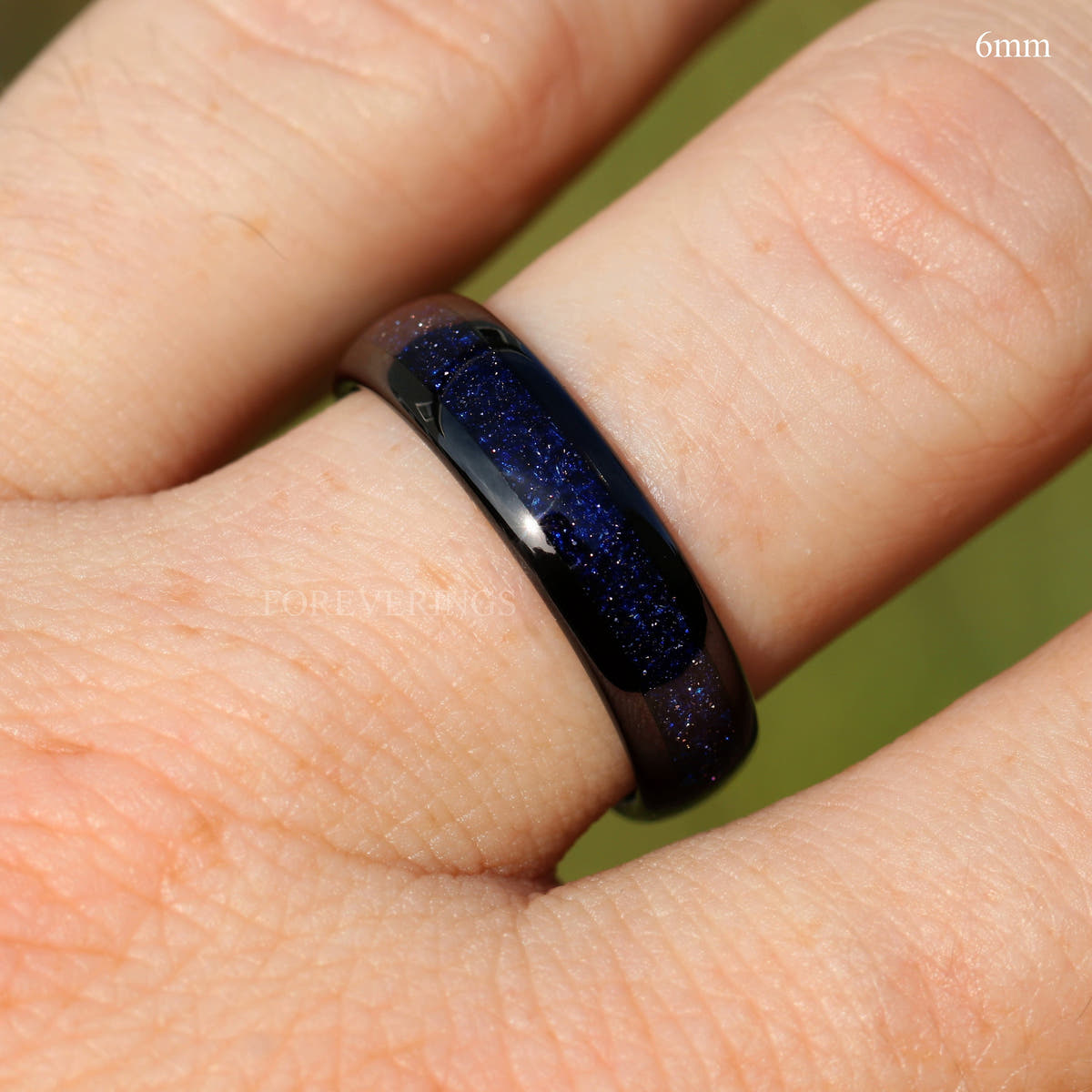6mm black tungsten ring with blue sandstone inlay on a finger, labeled 6mm