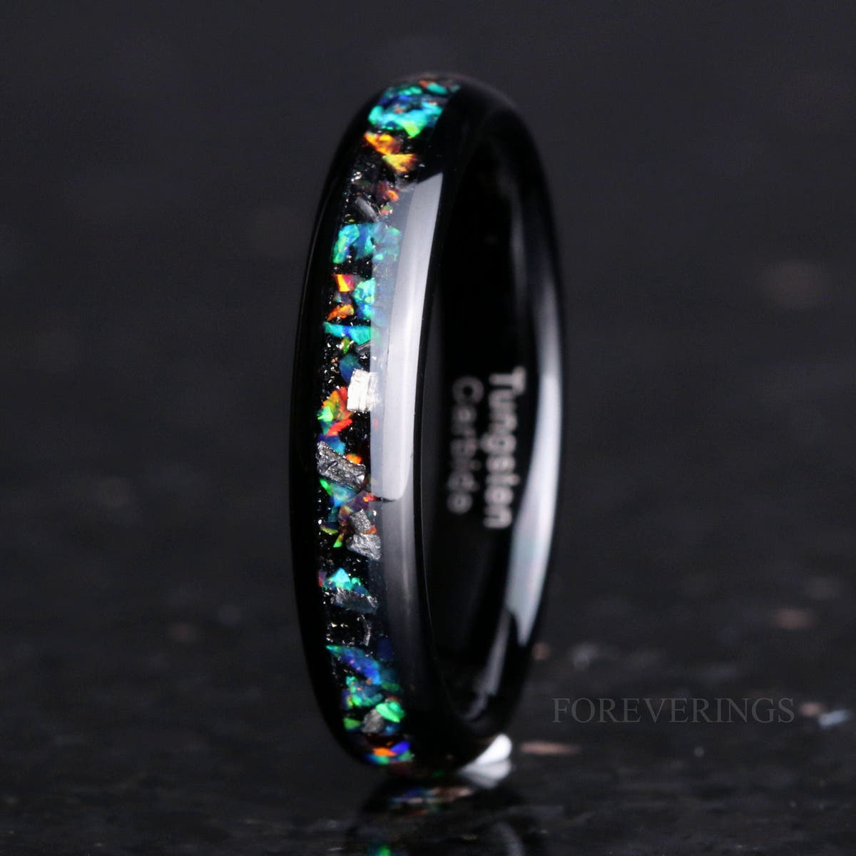 4mm black tungsten wedding band with meteorite and galaxy opal inlay, standing on edge