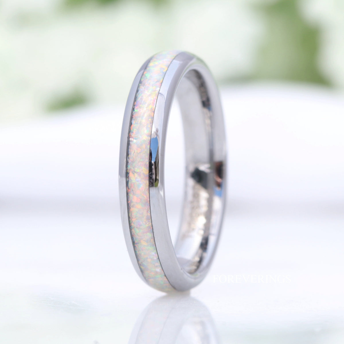 Women's 4mm silver tungsten ring with white fire opal inlay, standing upright