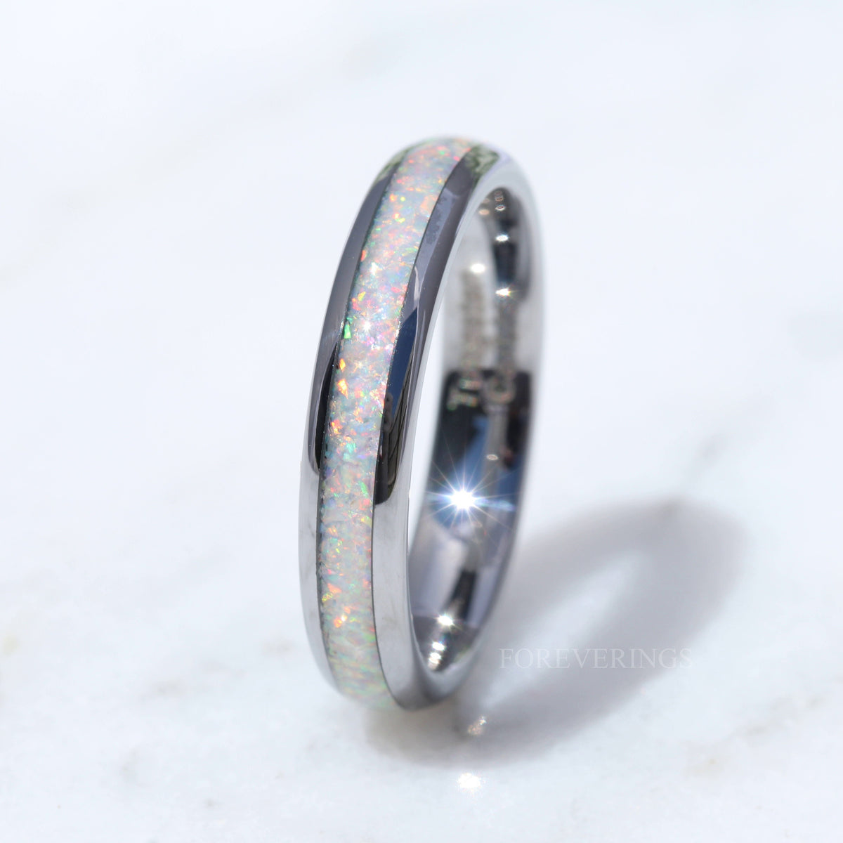 Women's 4mm white fire opal ring in silver tungsten, side view