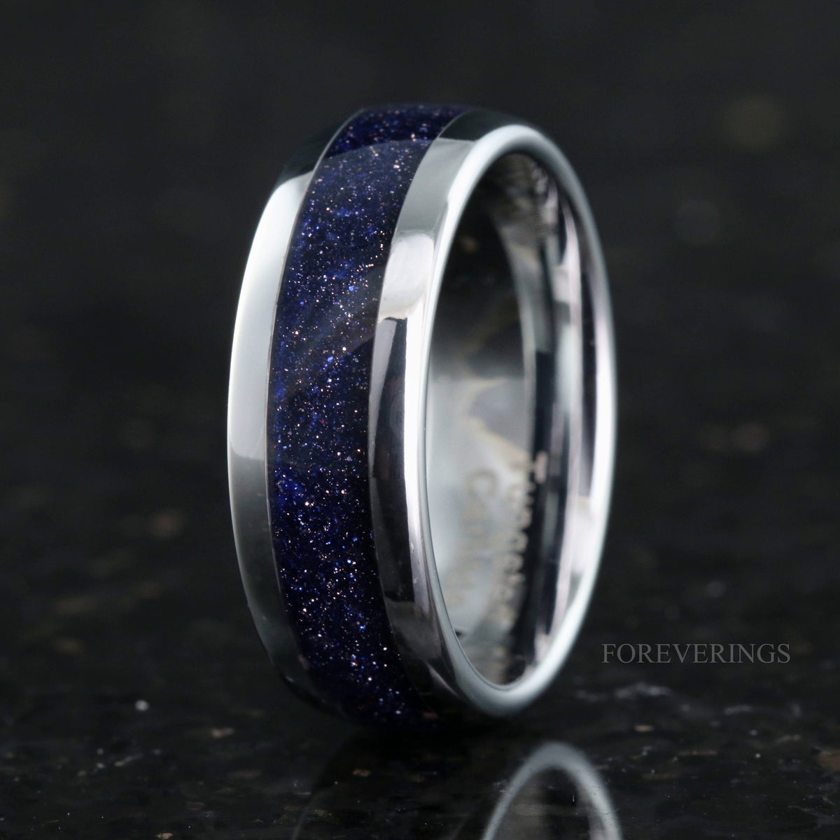 Men's 8mm silver tungsten band with blue sandstone inlay, standing upright