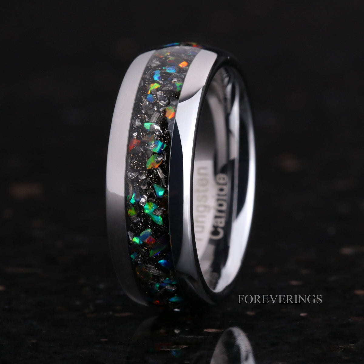 Men's 8mm polished silver tungsten band with meteorite and galaxy opal inlay, standing at an angle
