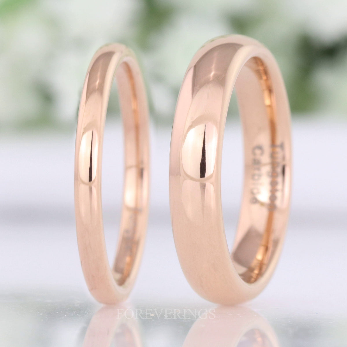 2mm and 4mm rose gold tungsten bands standing side by side