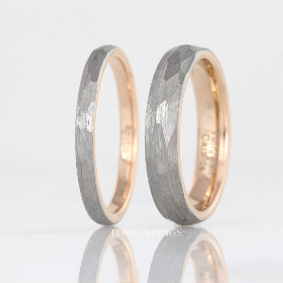 2mm and 4mm hammered silver tungsten bands with rose gold interiors, standing side by side