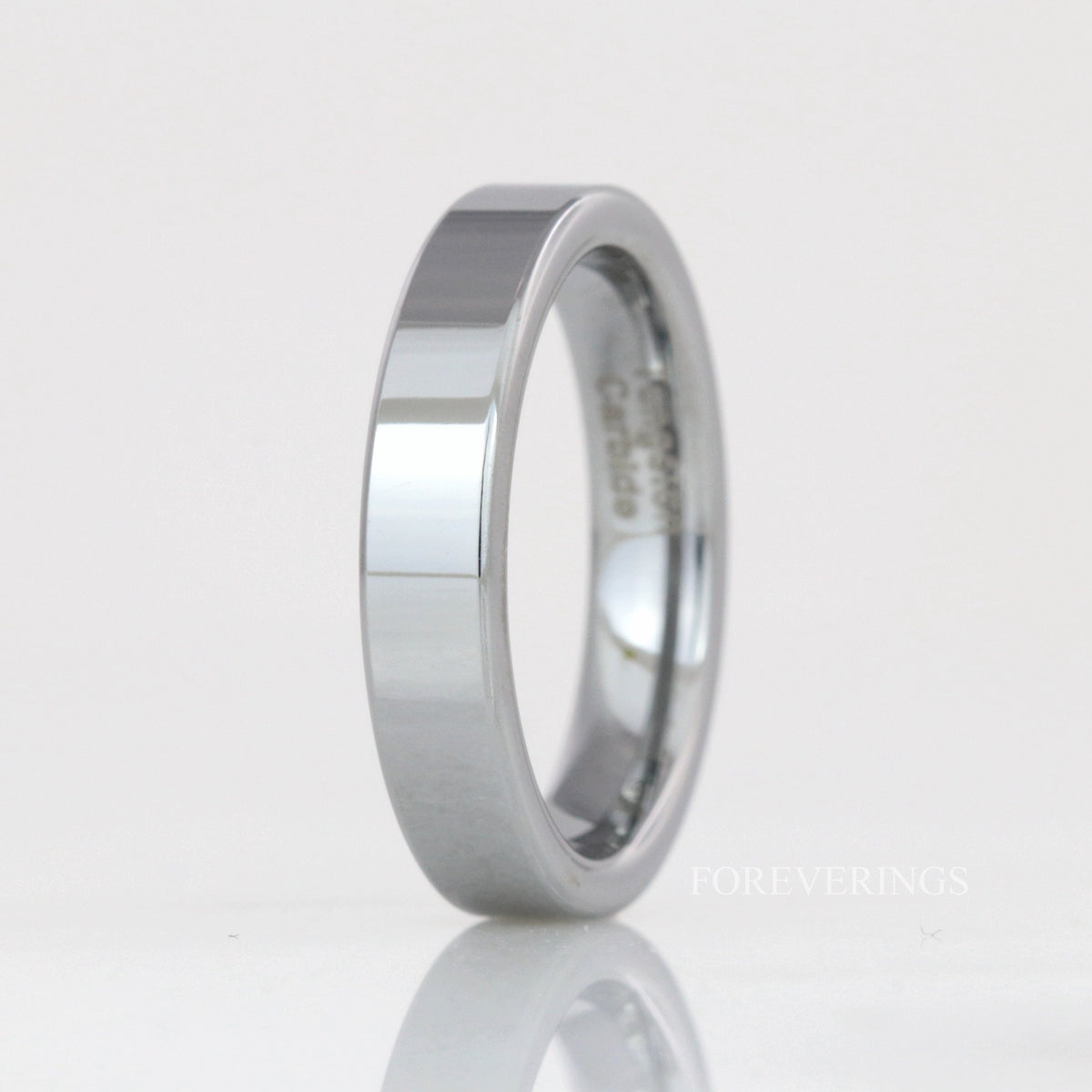 4mm flat silver tungsten wedding band standing upright, polished finish