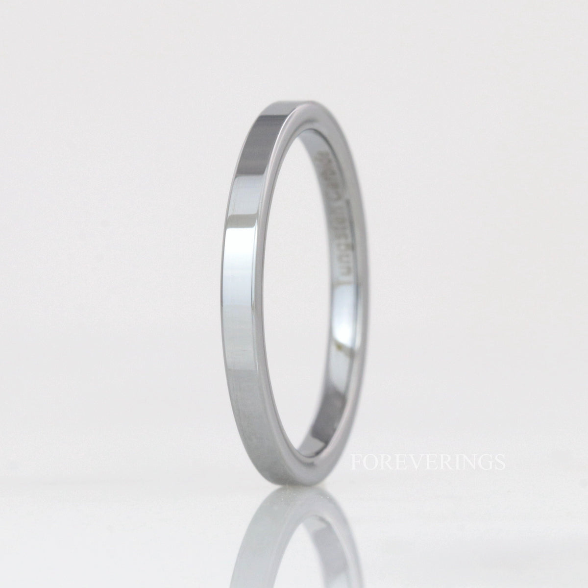 2mm thin flat silver tungsten band standing upright, polished finish