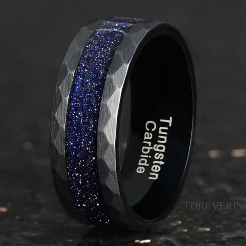Men's 8mm hammered black tungsten band with blue sandstone inlay, standing at an angle