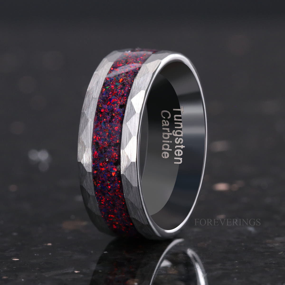 Men's 8mm hammered silver tungsten ring with black fire opal inlay, angled to show the interior