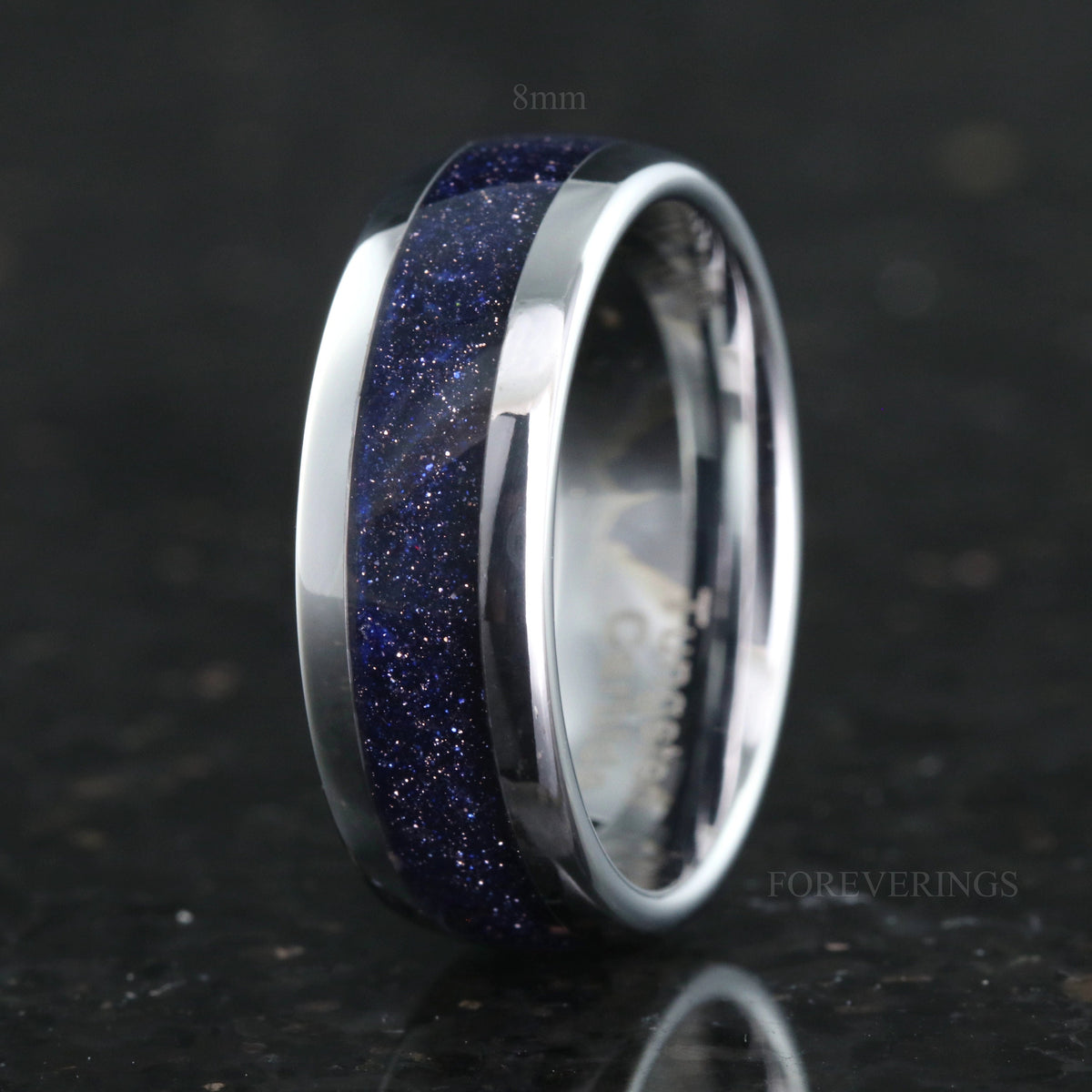 8mm polished silver tungsten band with blue sandstone inlay, standing at an angle