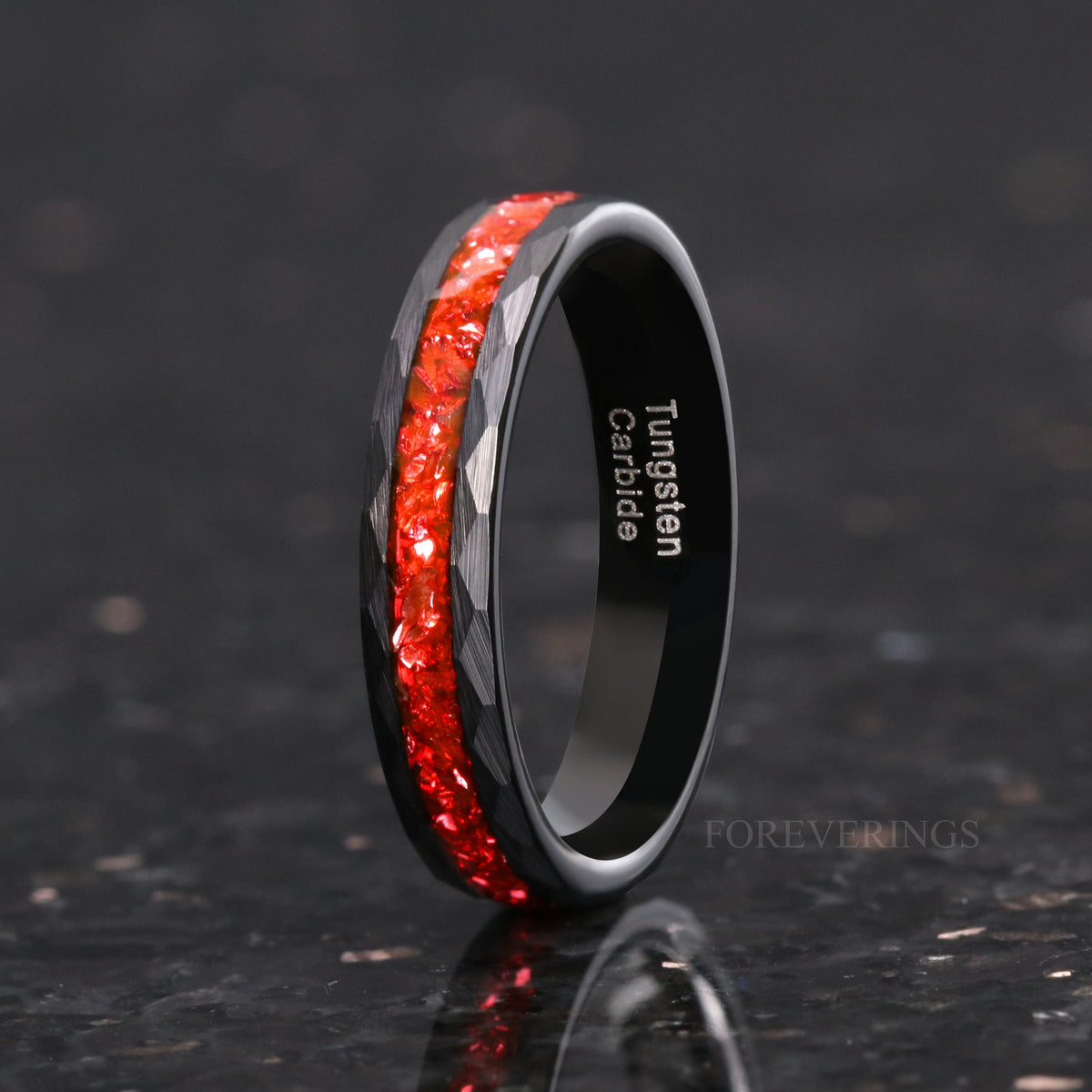 Women's 4mm black hammered tungsten band with crushed ruby inlay, standing