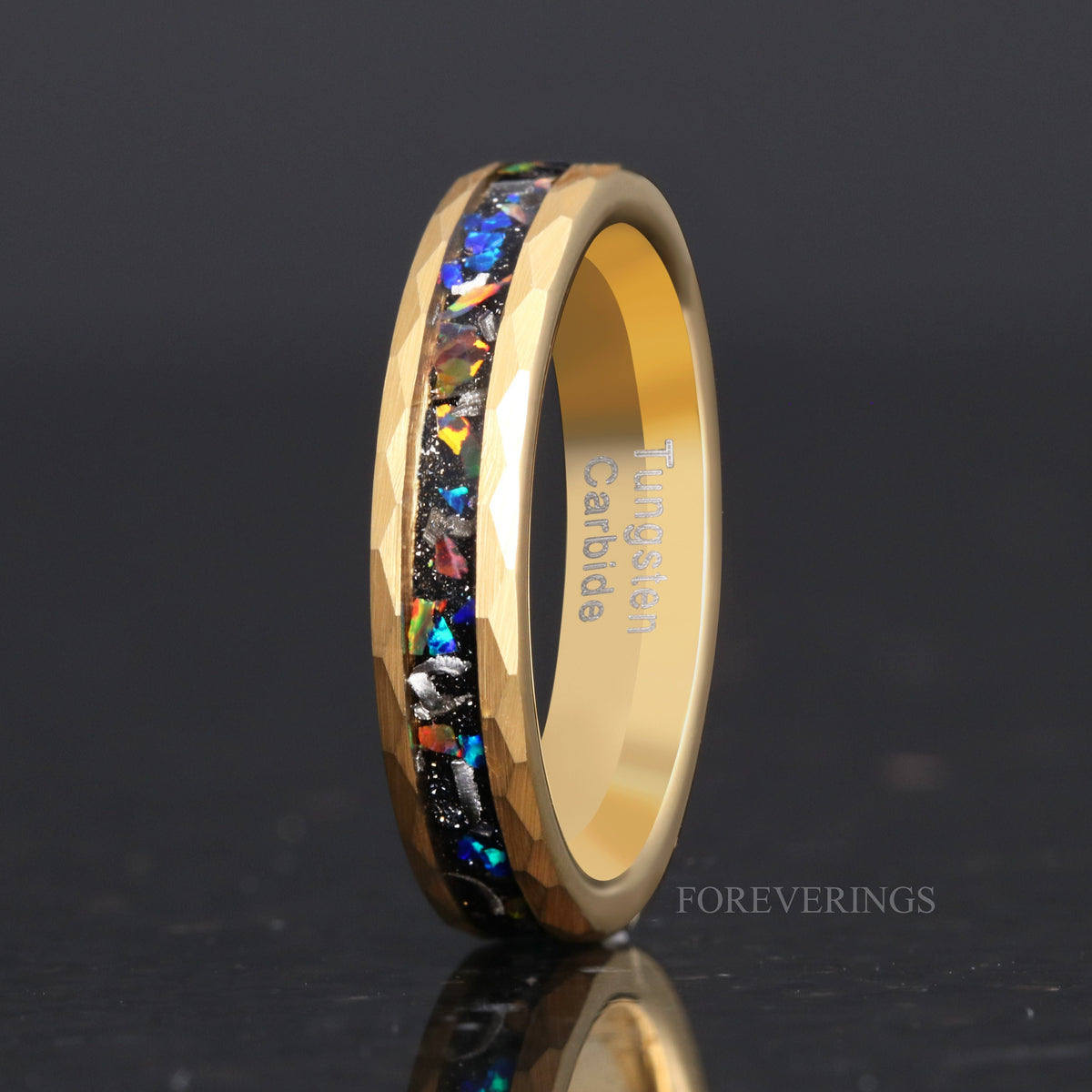 Women's 4mm hammered gold tungsten ring with meteorite and galaxy opal inlay, standing upright