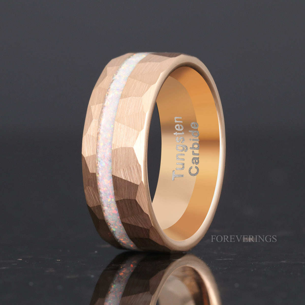 Men's 8mm rose gold hammered tungsten ring with crushed white fire opal, matte faceted finish