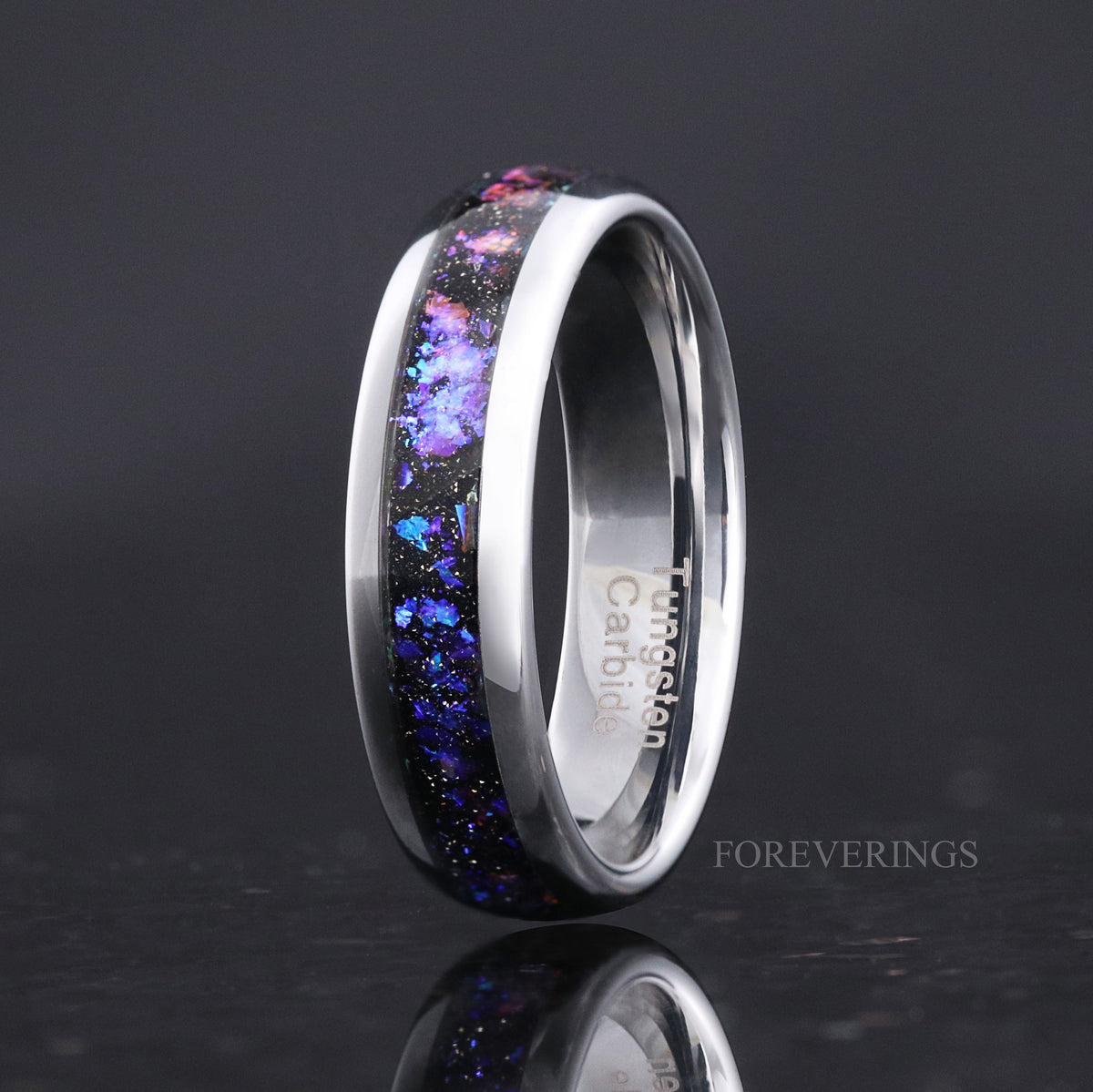 Men's 6mm silver tungsten band with blue and purple nebula sandstone inlay, angled to show the interior