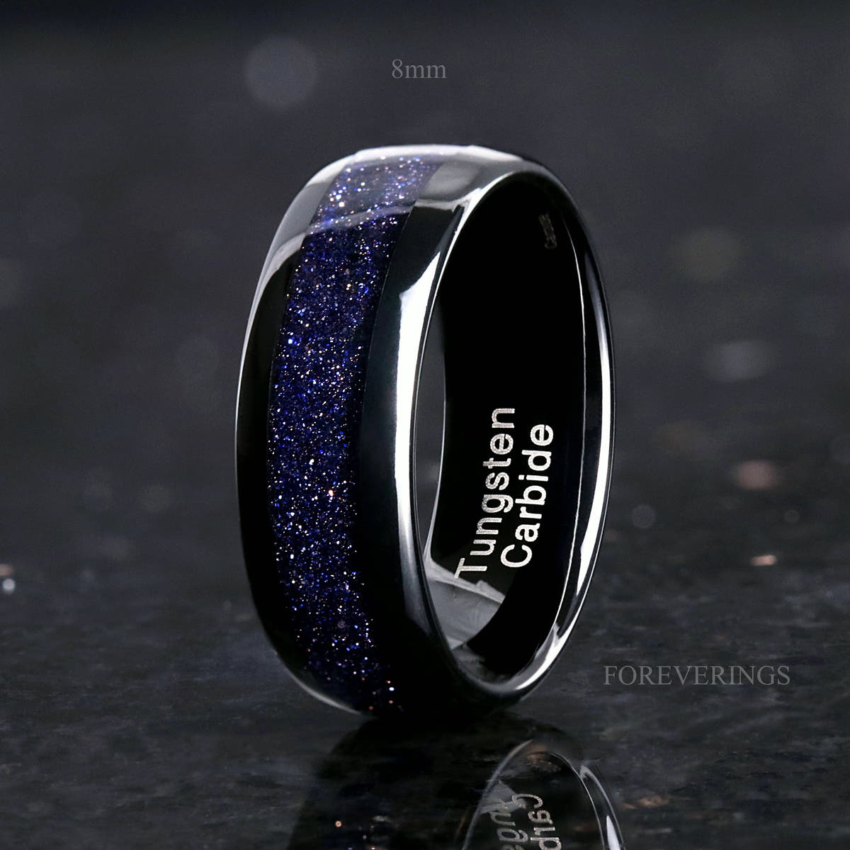8mm black tungsten band with blue sandstone inlay standing on edge, polished dome
