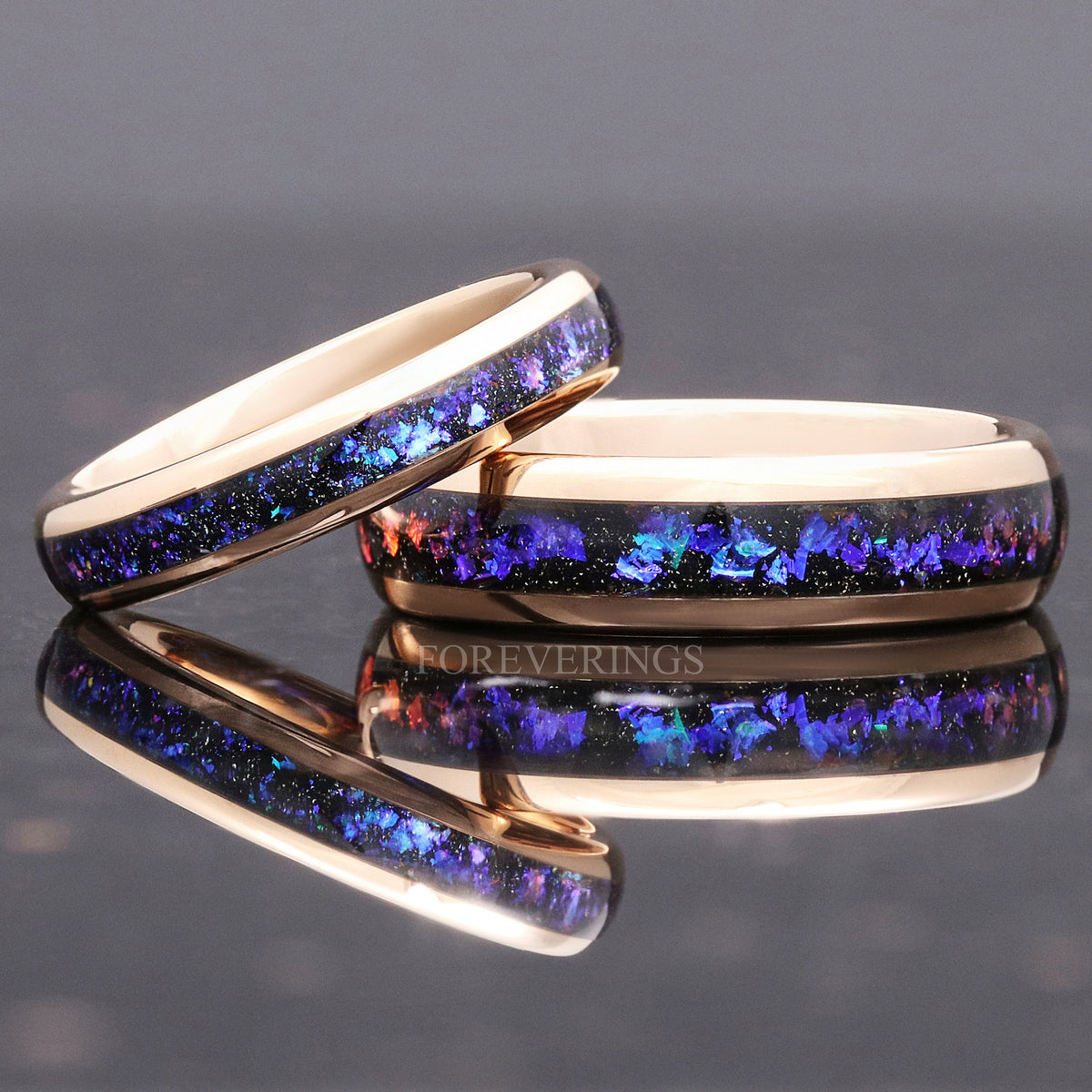 Narrow rose gold nebula band resting against the wide band, angled from the side