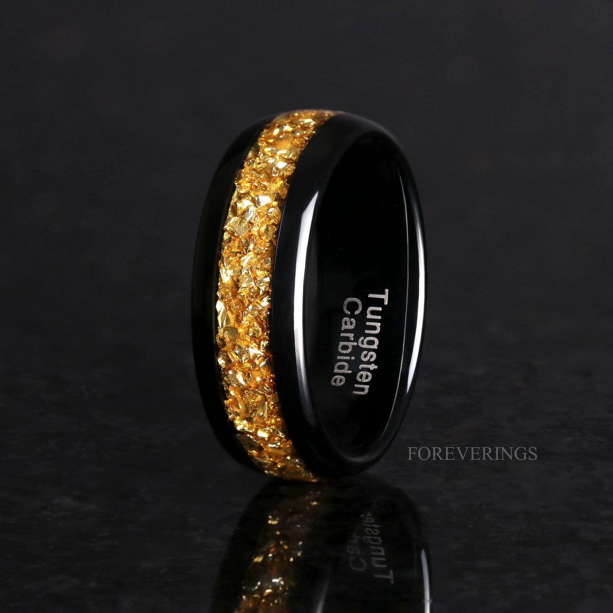 Men's 8mm black tungsten band with a crushed citrine stripe, standing to show the interior