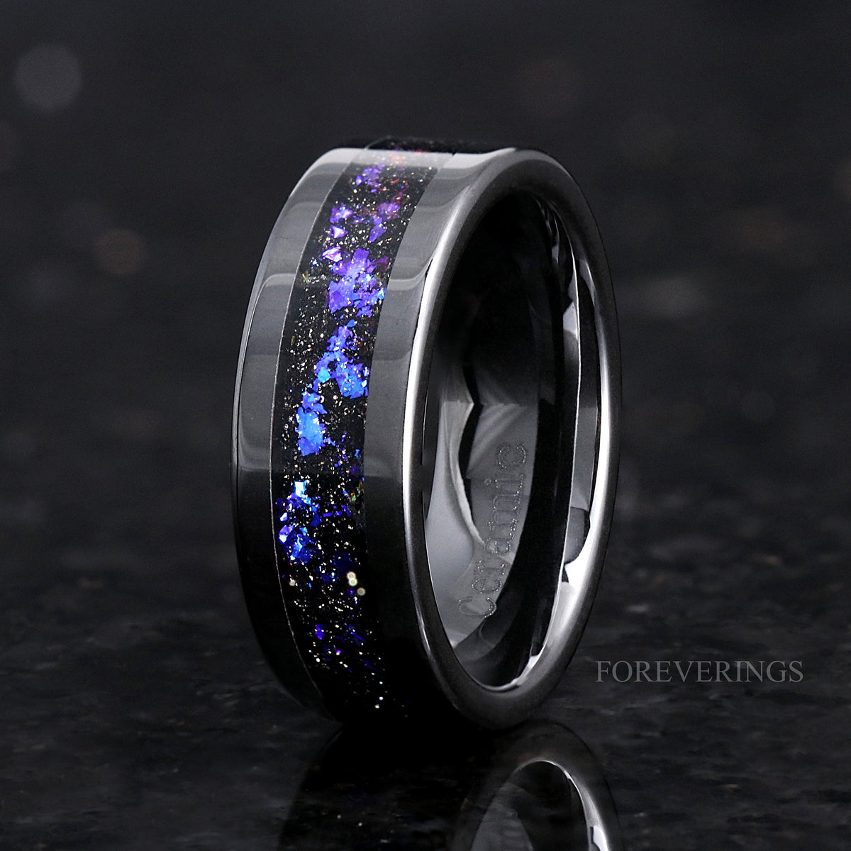 Men's 8mm black ceramic band with nebula sandstone inlay, angled to show the inside