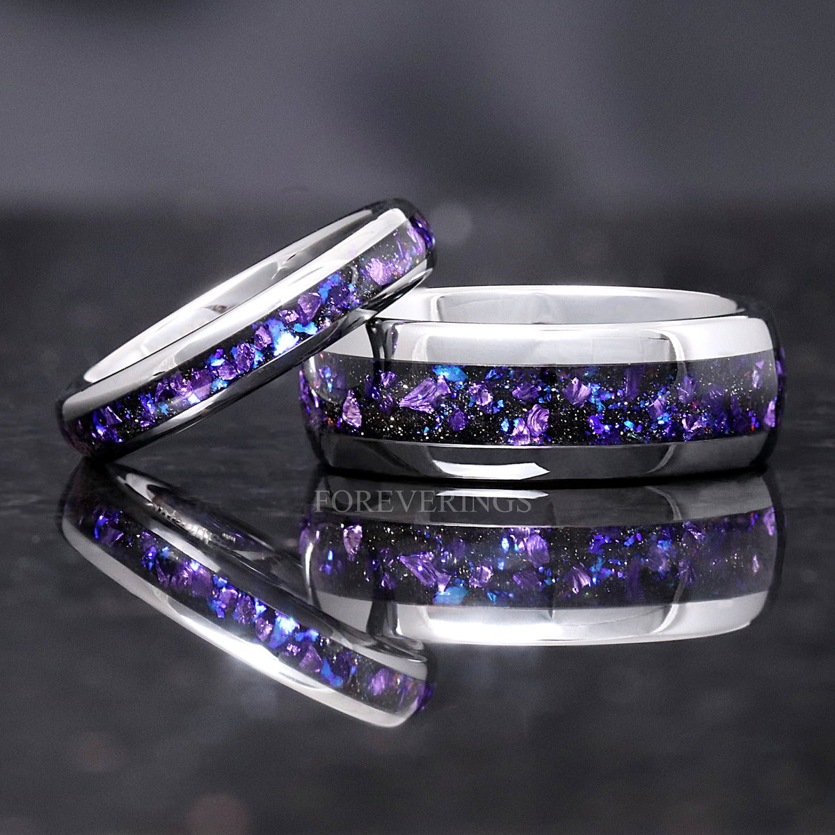 4mm silver tungsten Crab nebula ring leaning on a wider ring with the same inlay
