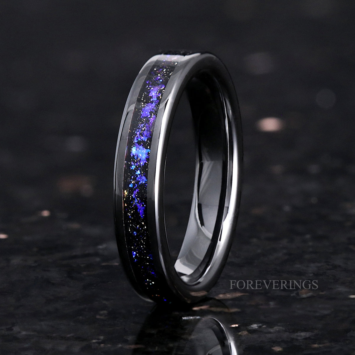 Women's 4mm black ceramic ring with Orion nebula sandstone inlay, standing