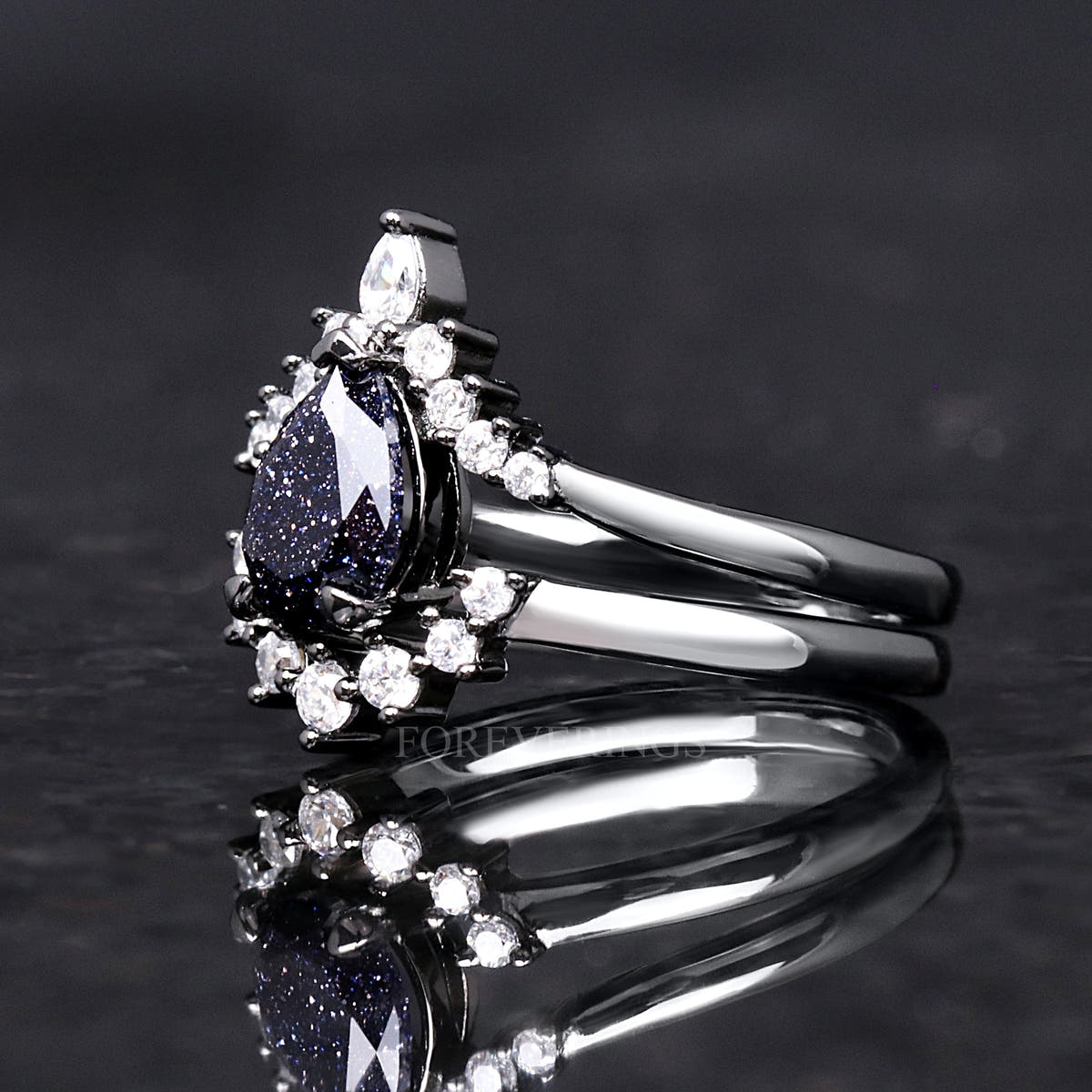 Pear blue sandstone engagement ring and crown band in black sterling silver, side view