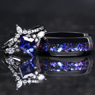 Matching black couples ring set: kite-cut blue sapphire engagement ring and 8mm tungsten nebula band