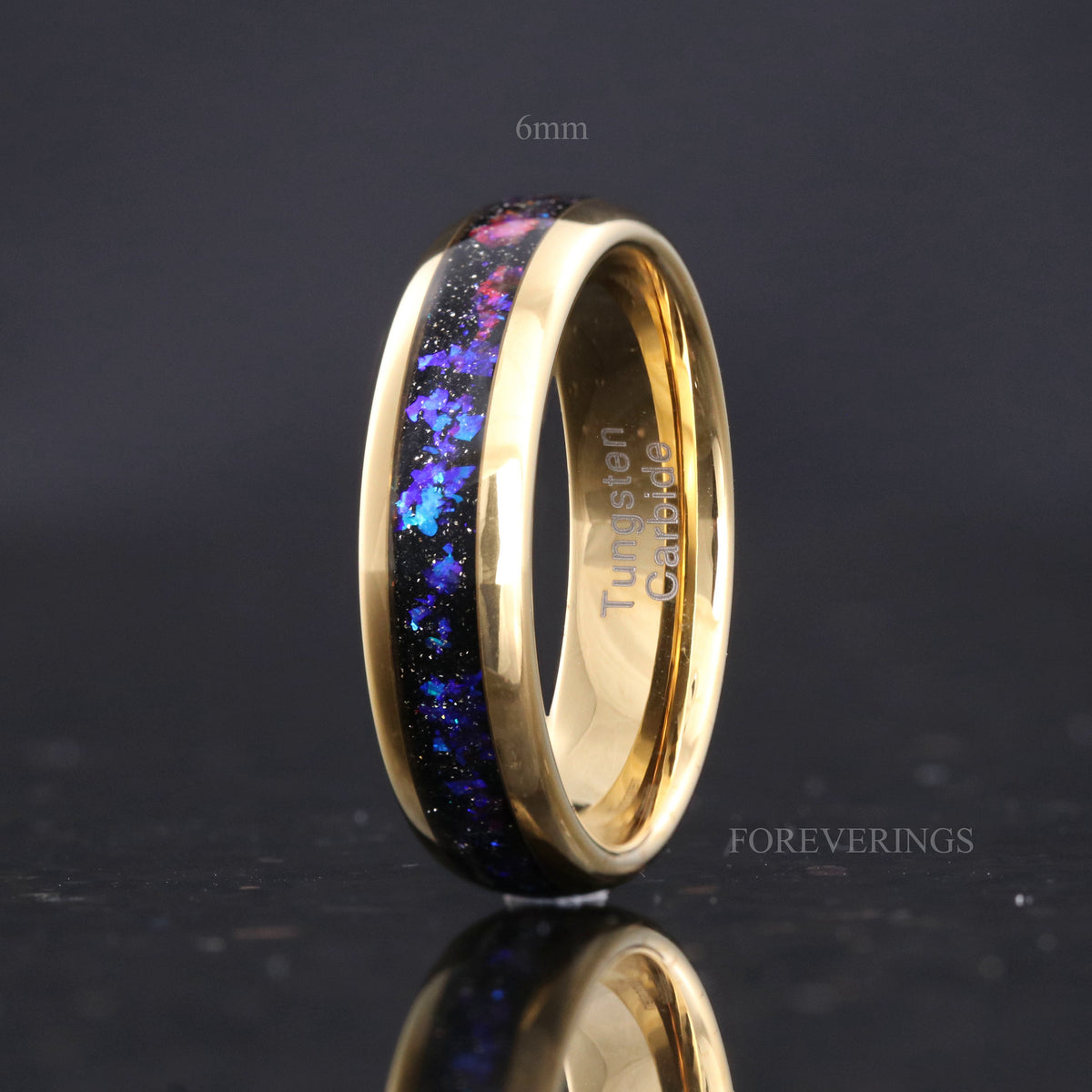Gold tungsten band labeled 6mm with nebula sandstone inlay, standing angled toward the interior