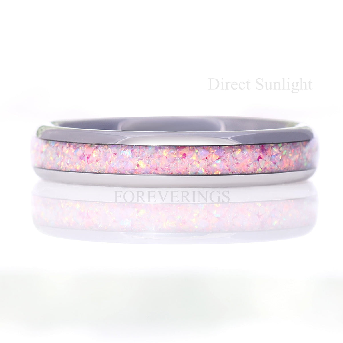 4mm unicorn fire opal ring in silver tungsten, straight on in direct sunlight