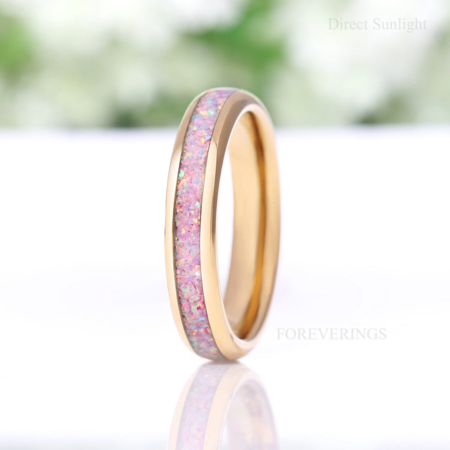 Unicorn fire opal ring in gold tungsten photographed in direct sunlight, labeled Direct Sunlight