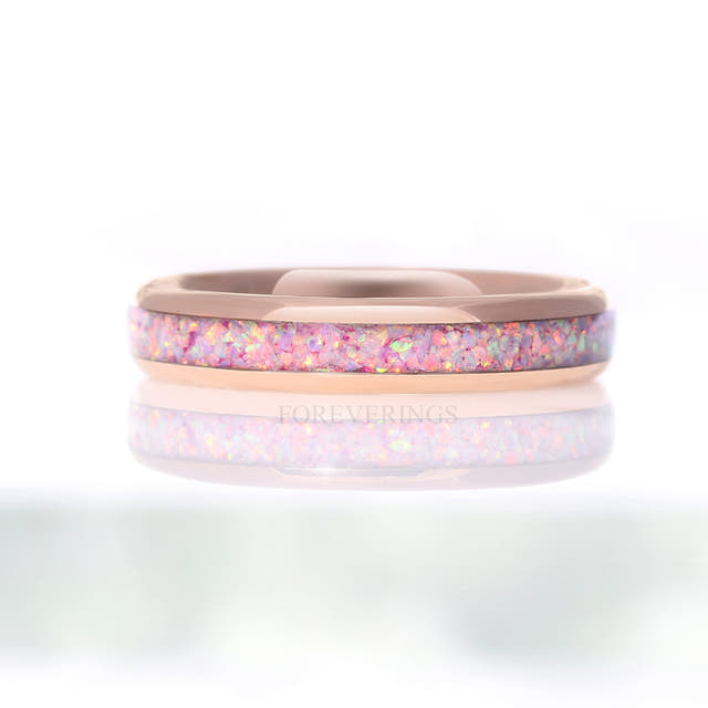 Rose gold tungsten unicorn fire opal ring shown straight on with its reflection