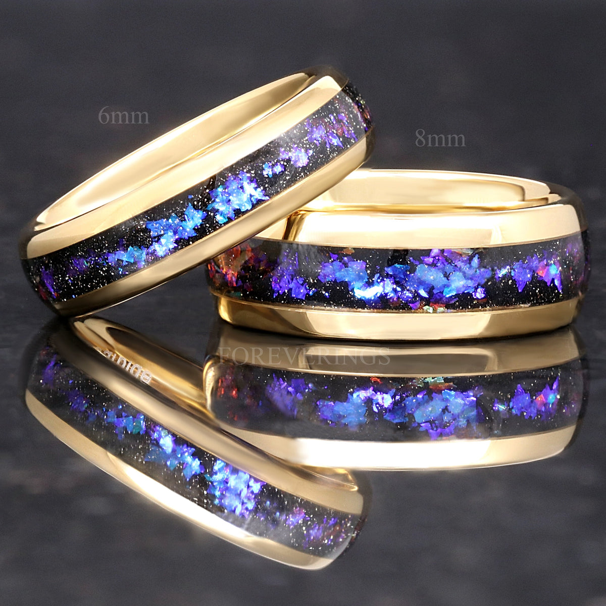 6mm and 8mm gold tungsten bands with nebula sandstone inlay, the 6mm leaning on the 8mm