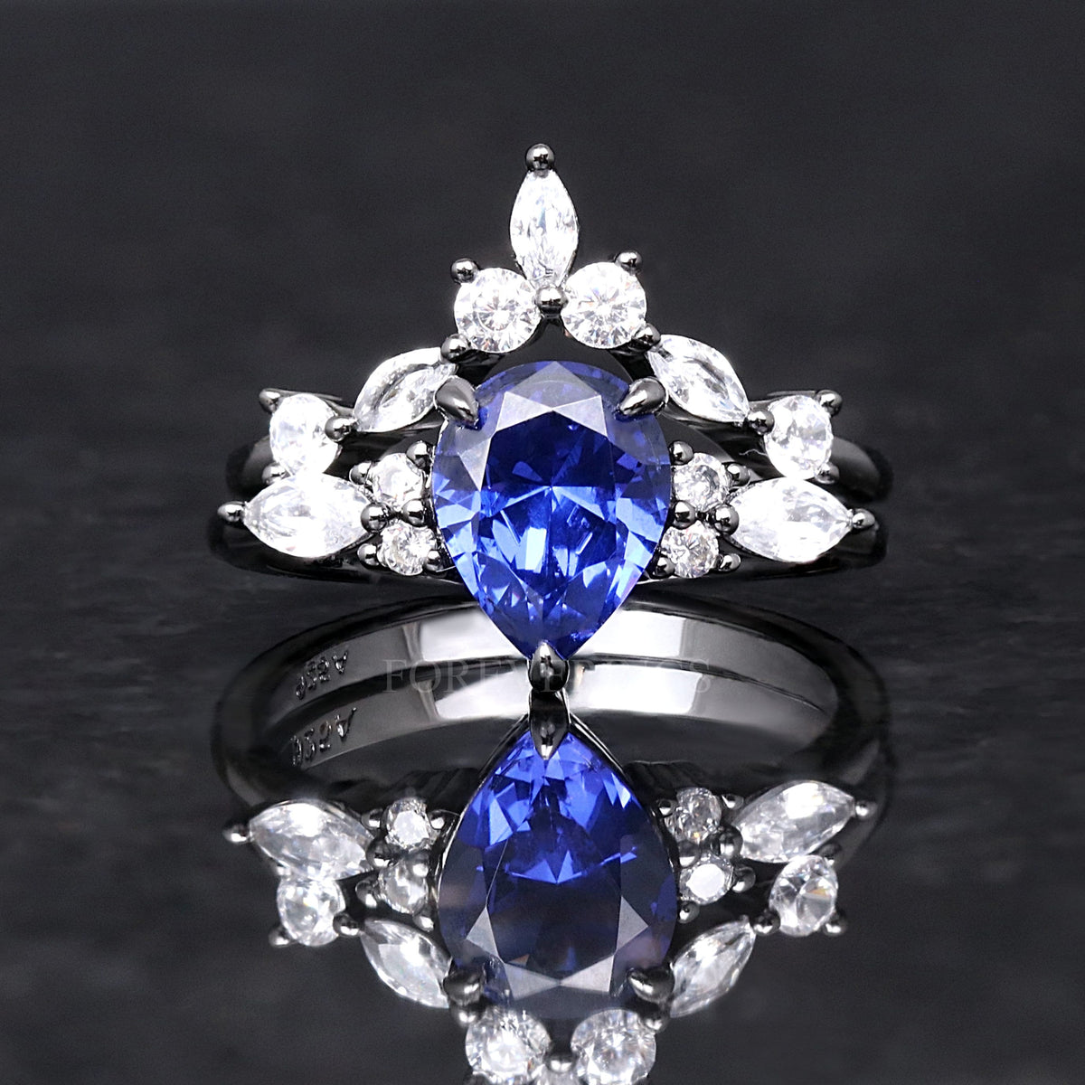 Black sterling silver pear sapphire bridal set with marquise accents, shown straight on