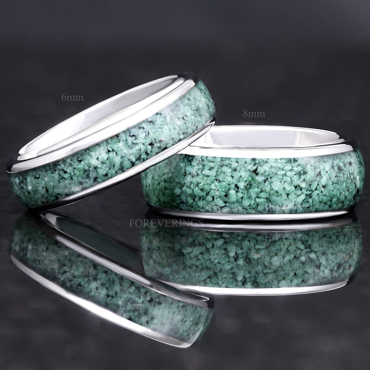 6mm silver moss agate ring leaning on an 8mm band with the same inlay, reflection below