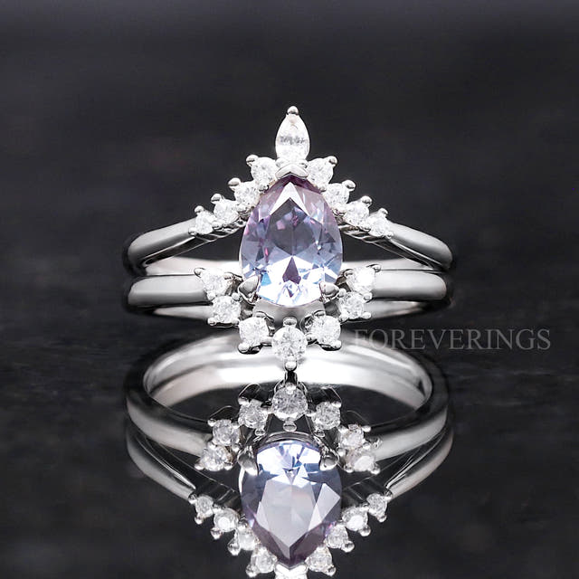 Pear-cut alexandrite bridal set shown straight on in a wider view, reflection below