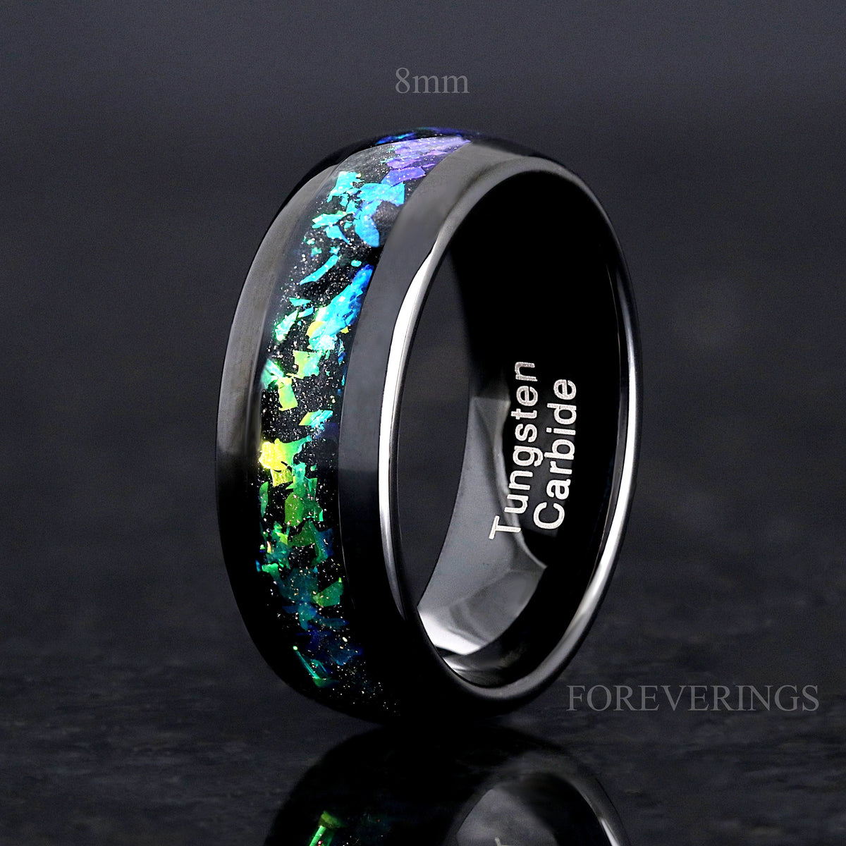 Men's 8mm black tungsten band with green nebula inlay, polished dome, standing upright