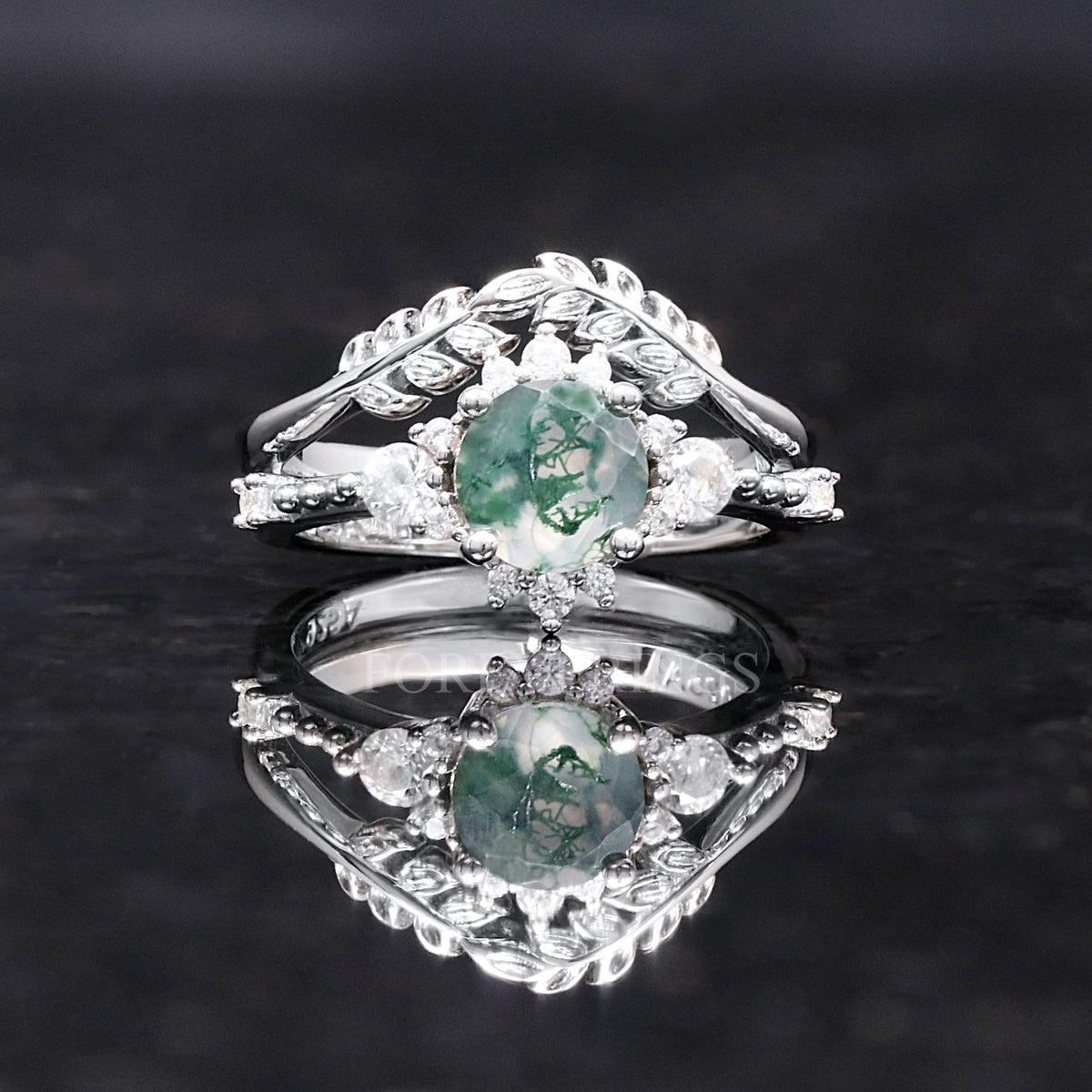 Sterling silver round moss agate engagement ring with leaf band, shown straight on