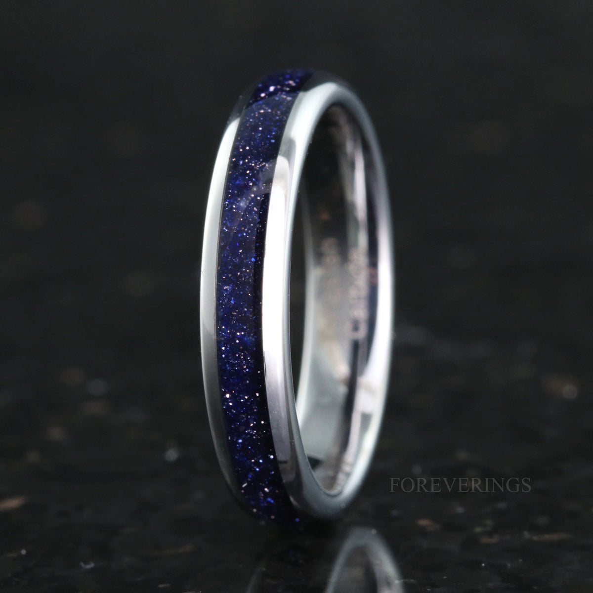 4mm silver tungsten band with blue sandstone inlay, standing on edge