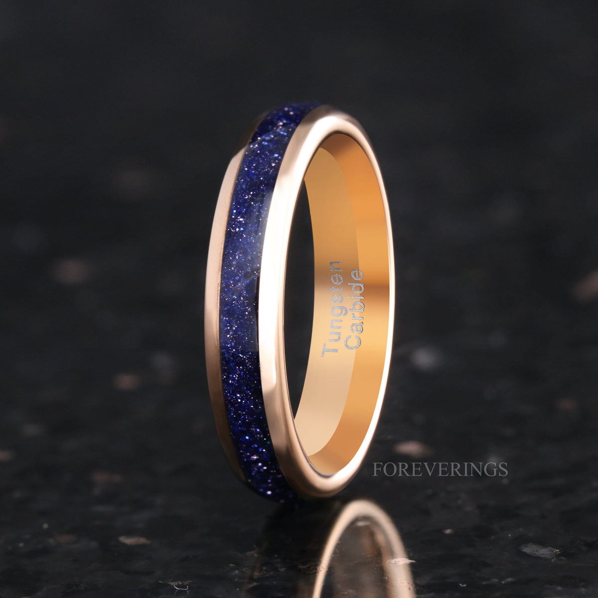 4mm rose gold tungsten band with blue sandstone inlay standing on edge, angled view