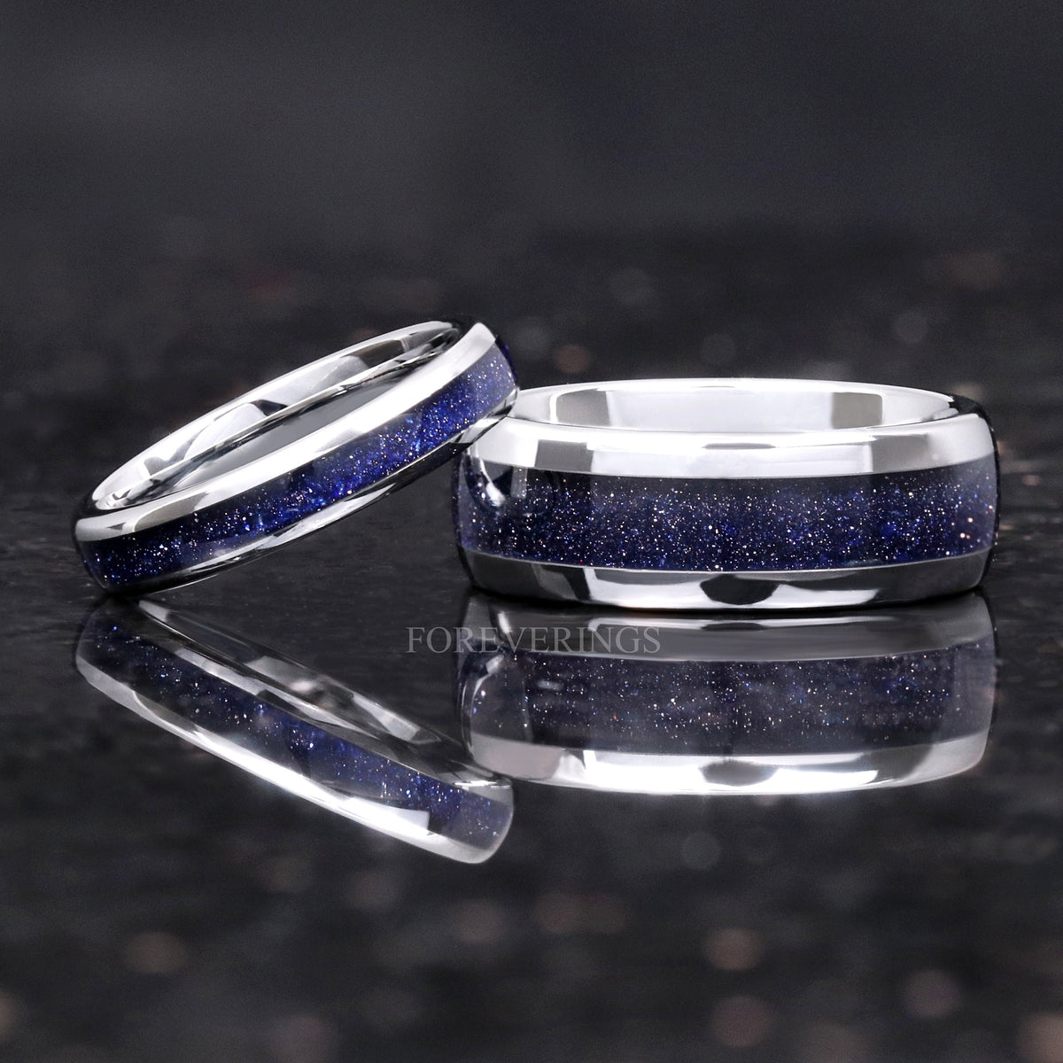 Two widths of silver tungsten blue sandstone band side by side, wider view with reflection