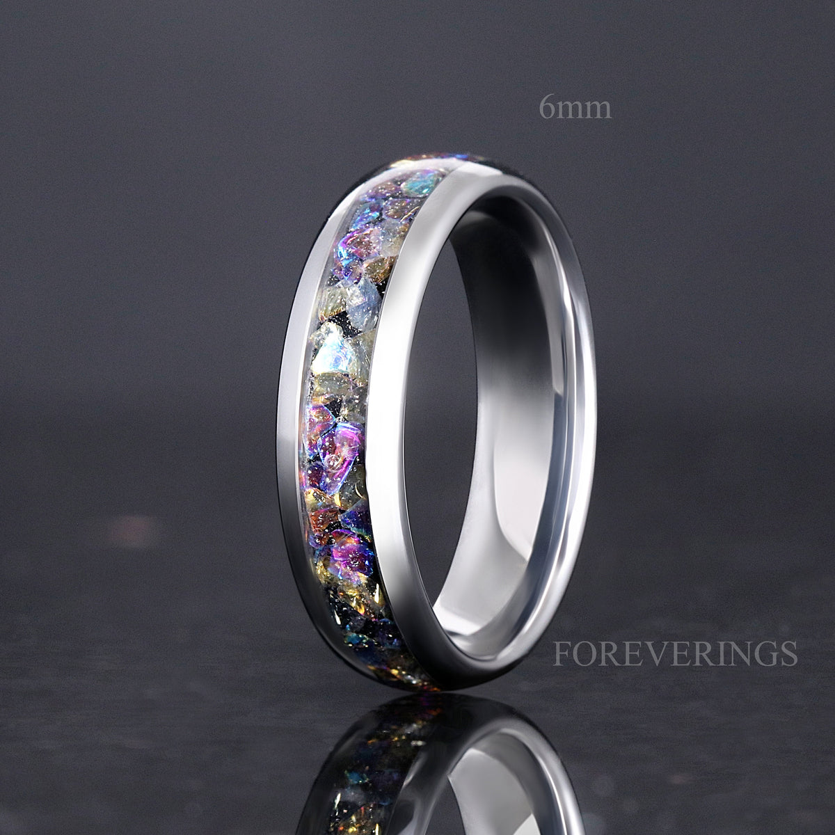 Silver tungsten ring labeled 6mm with moonstone inlay, standing angled toward the interior