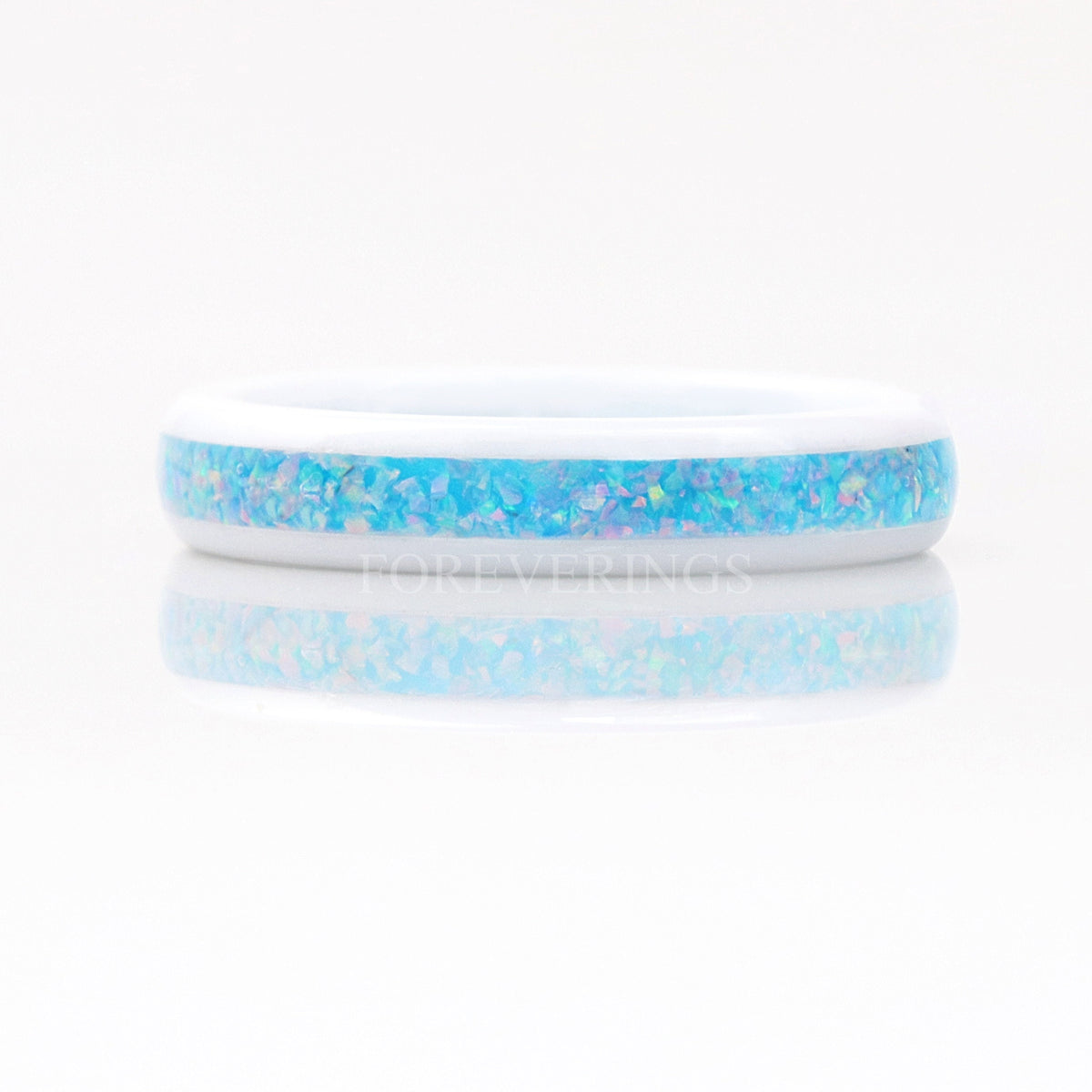 White ceramic rainbow opal ring viewed straight on across the inlay