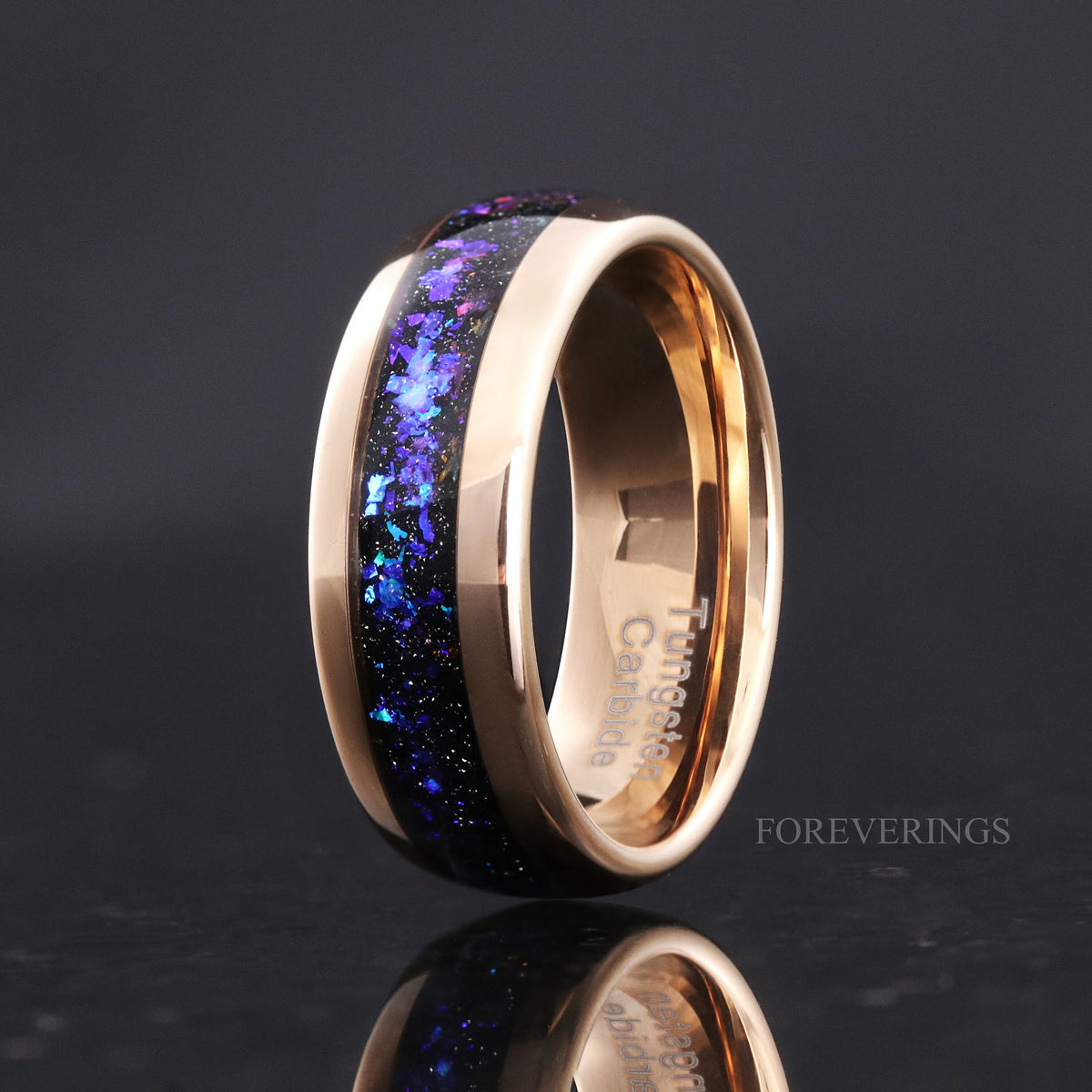 Men's 8mm rose gold tungsten band with nebula sandstone inlay, standing angled to show the interior