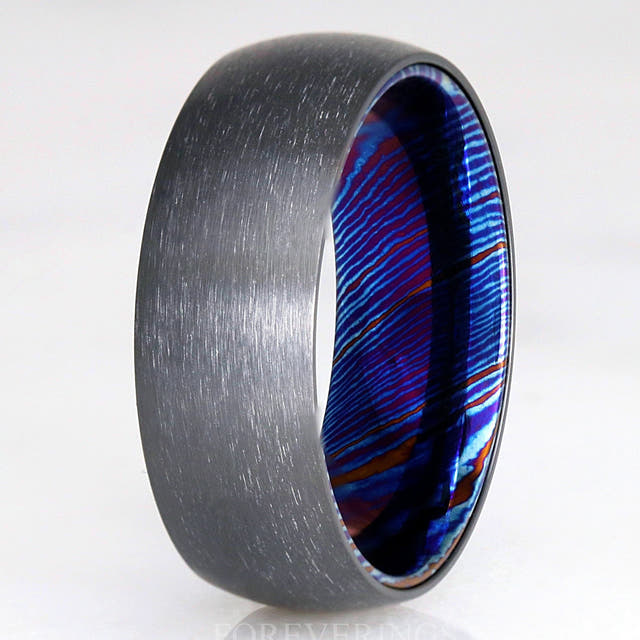 Men's 8mm brushed black zirconium wedding band with a blue Timascus sleeve inside