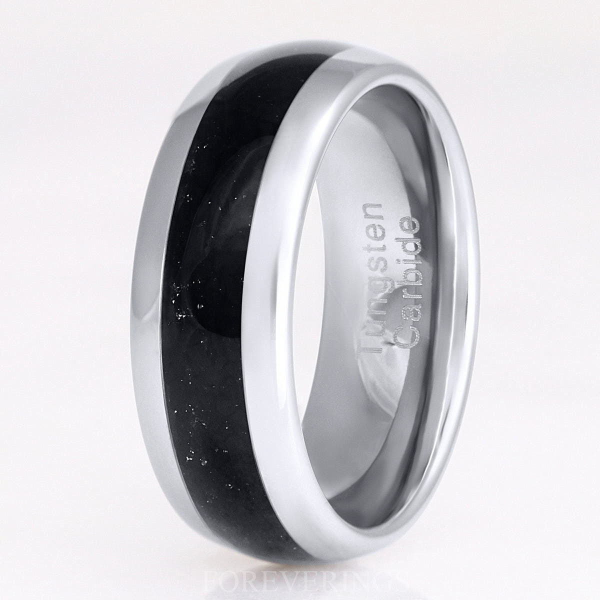 Men's 8mm silver tungsten ring with black onyx inlay, standing close-up