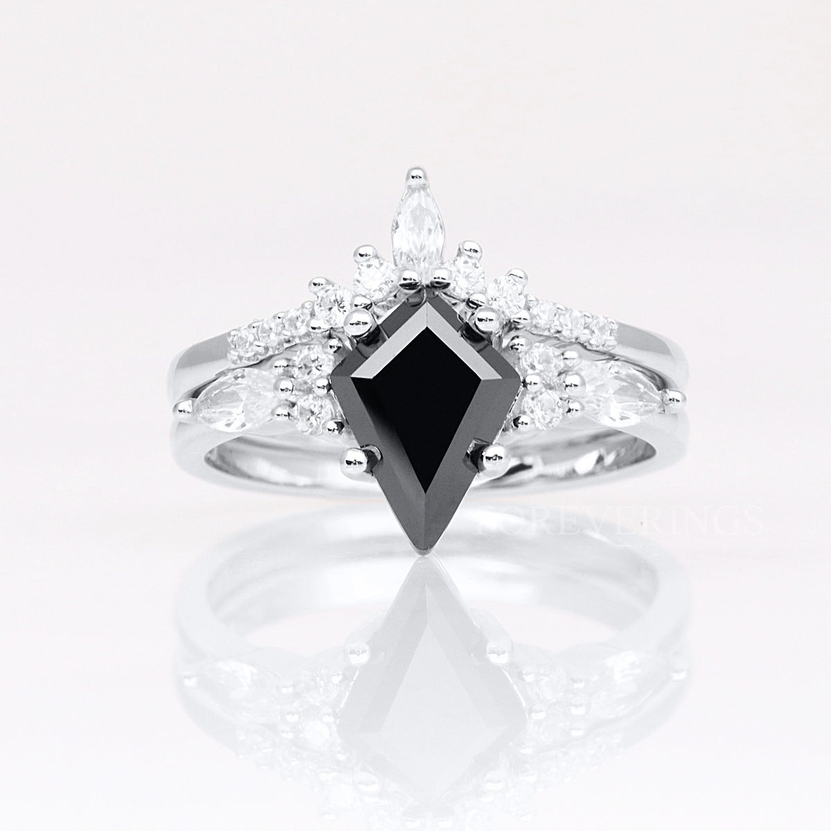 Women's sterling silver kite-cut black onyx ring with a curved accent band, shown straight on