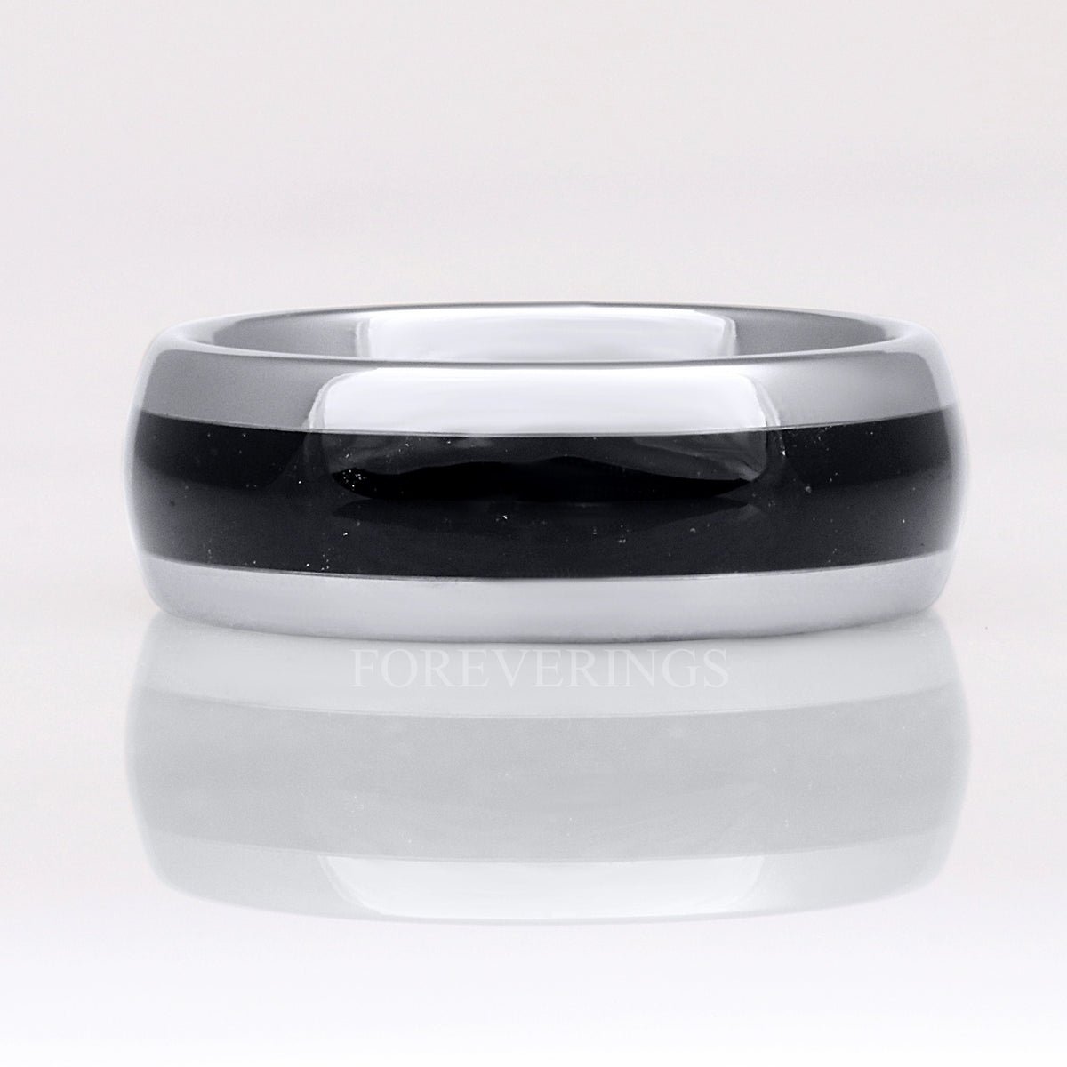 Silver tungsten black onyx ring shown straight on, polished dome with reflection